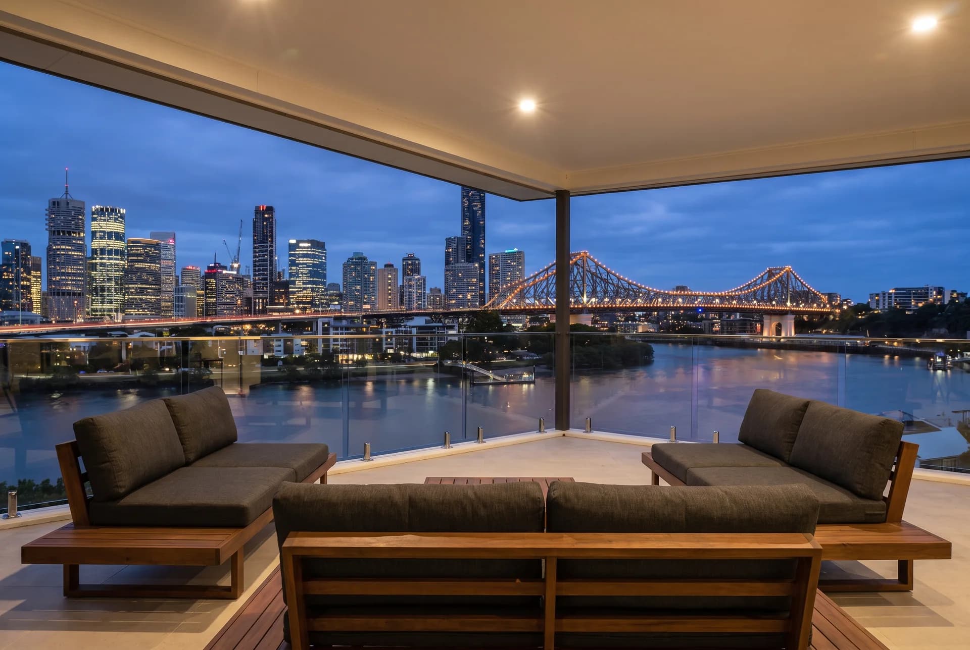 Kangaroo Point terrace with Brisbane skyline at dusk